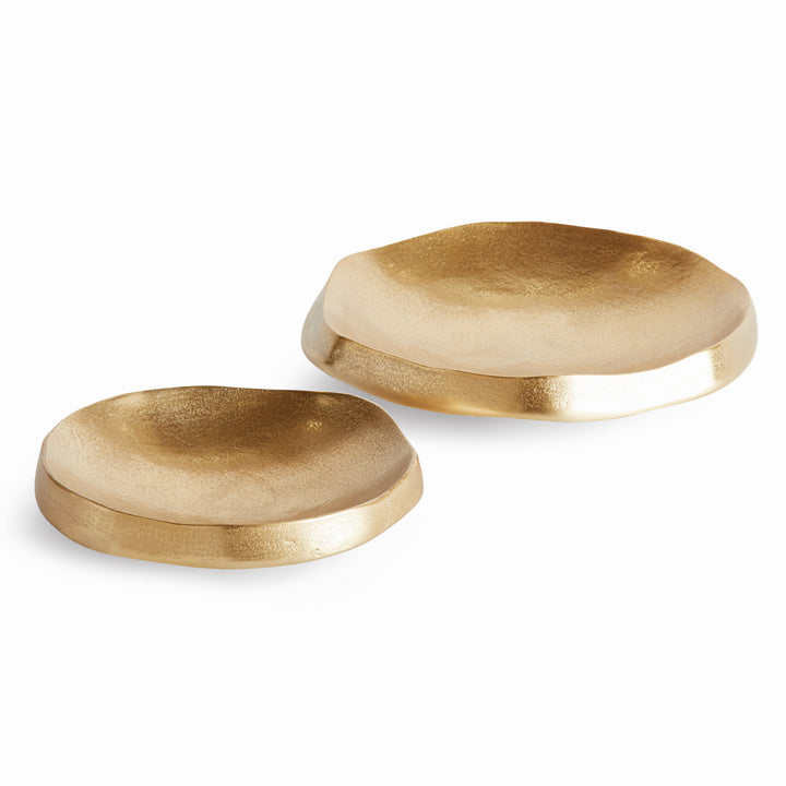Set of gold decorative aluminum bowls with organic round shapes, thick edges and textured interiors on white - Modern Organic