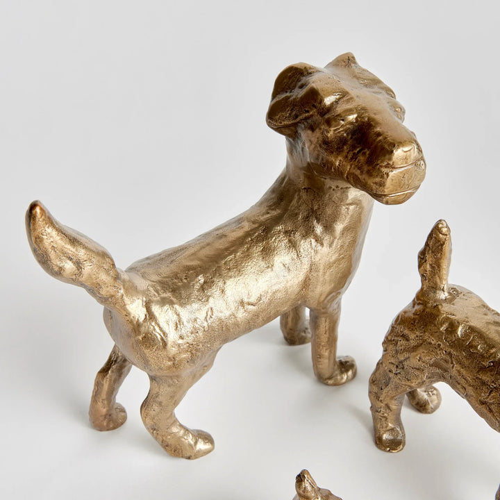 Gold aluminum dog figurine with elongated form and textured surface, side profile of decorative tabletop sculpture – Transitional
