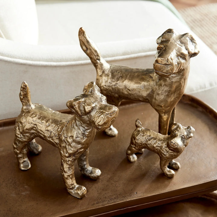 Gold dog figurines styled on tray with sculptural texture and varied sizes, decorative animal accents for tabletop display – Transitional