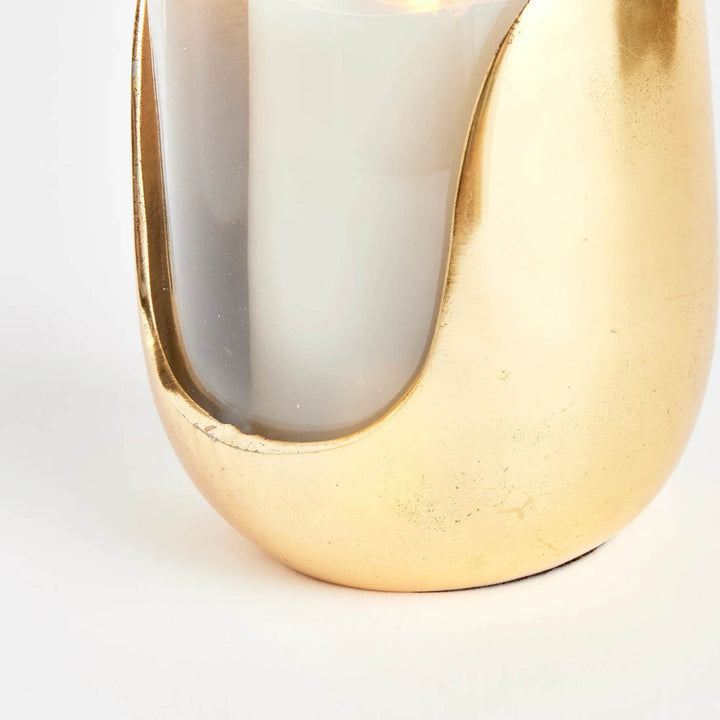 Close-up of champagne gold aluminum base with clear glass cylinder for medium hurricane candle holder