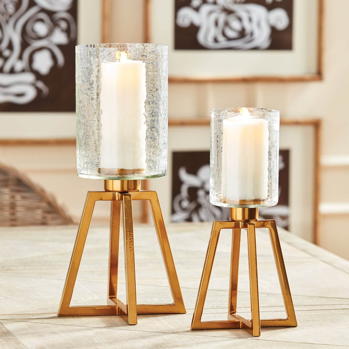 Two hammered glass hurricanes with gold iron bases, shown side by side for scale and style contrast – Industrial Modern

