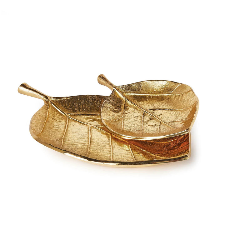 Set of two gold decorative leaf trays with textured aluminum finish shown stacked on white background – Wabi-Sabi.

