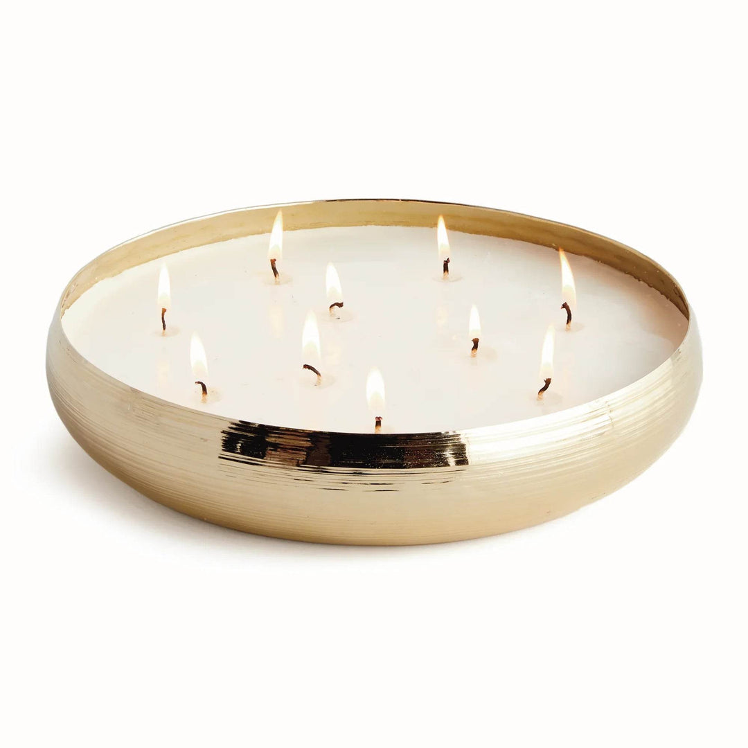 Large gold metal multi-wick candle with 10 lit wicks and soy wax blend in a low round vessel, scented with sandalwood and musk – Modern Organic.

