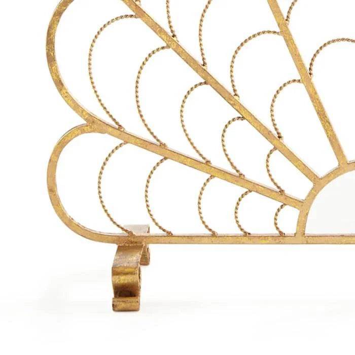 Close-up of Italian gold shell fireplace screen showing iron foot detail and open scallop design.



