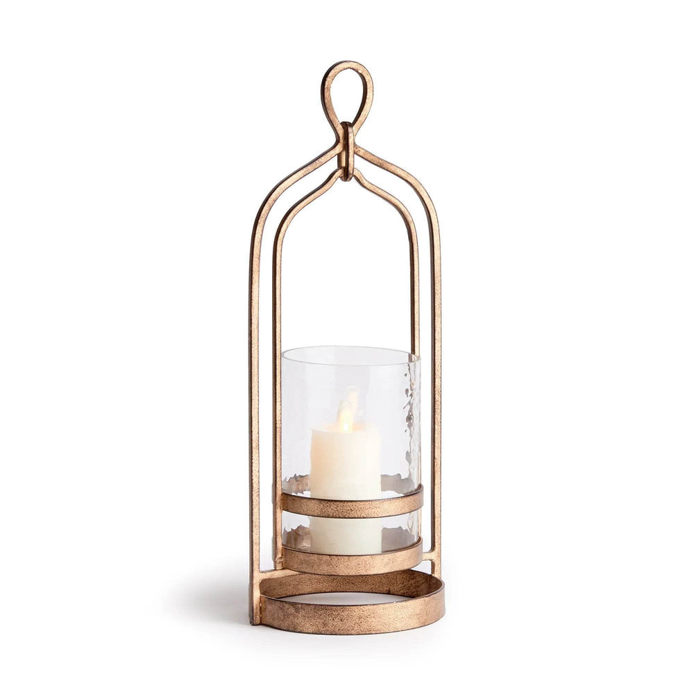 Front view of transitional gold hurricane candle holder with hammered glass cylinder and decorative loop handle, iron frame base – Transitional