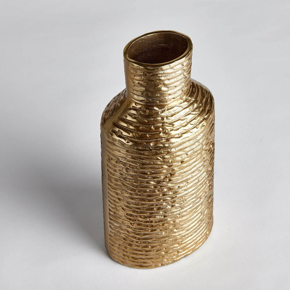 Angled view of small gold textured aluminum vase showing clean silhouette and subtle banding

