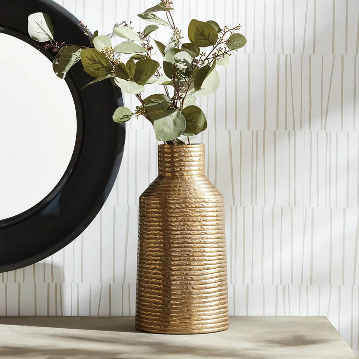 Gold textured aluminum vase styled with matching smaller vase, console styling with greenery

