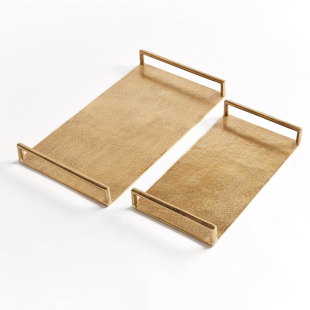 Set of two gold textured decorative trays in cast aluminum with open handles, shown at angled view on white – Transitional.