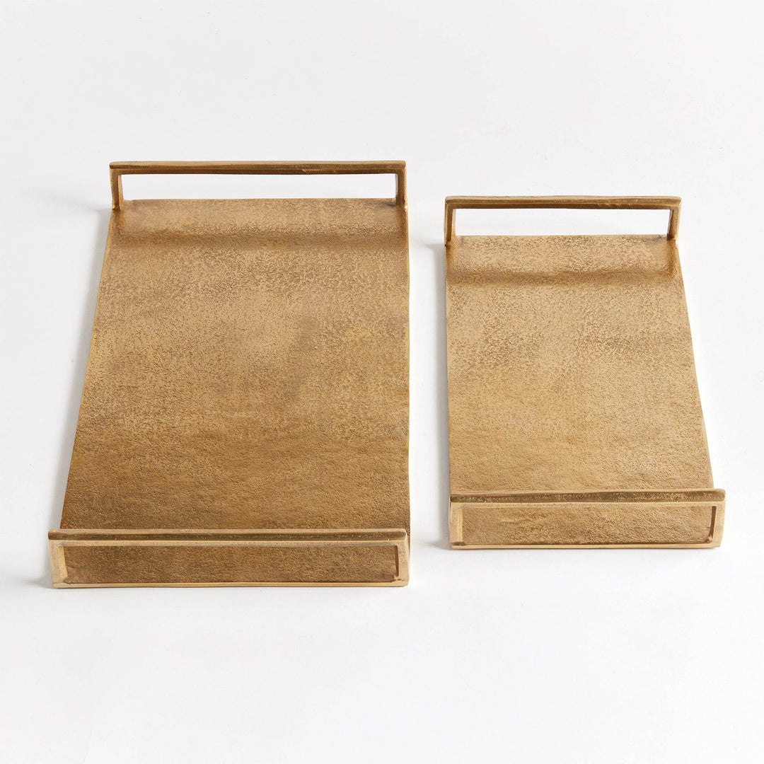 Top view of rectangular gold textured decorative trays, set of two, showing open handles and smooth rim edges – Transitional.