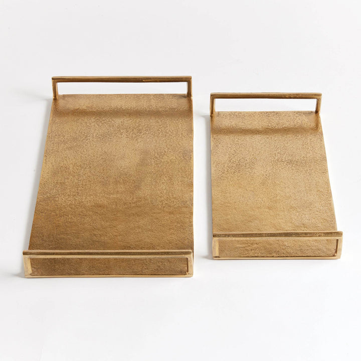 Top view of rectangular gold textured decorative trays, set of two, showing open handles and smooth rim edges – Transitional.