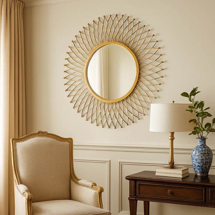 Traditional style interior with gold wall mirror above console, styled with classic decor in warm neutral tones.