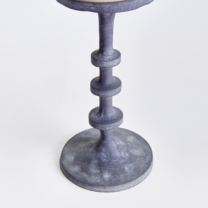 Detailed view of textured gray aluminum candle holder with sculptural stacked spindle design – Transitional