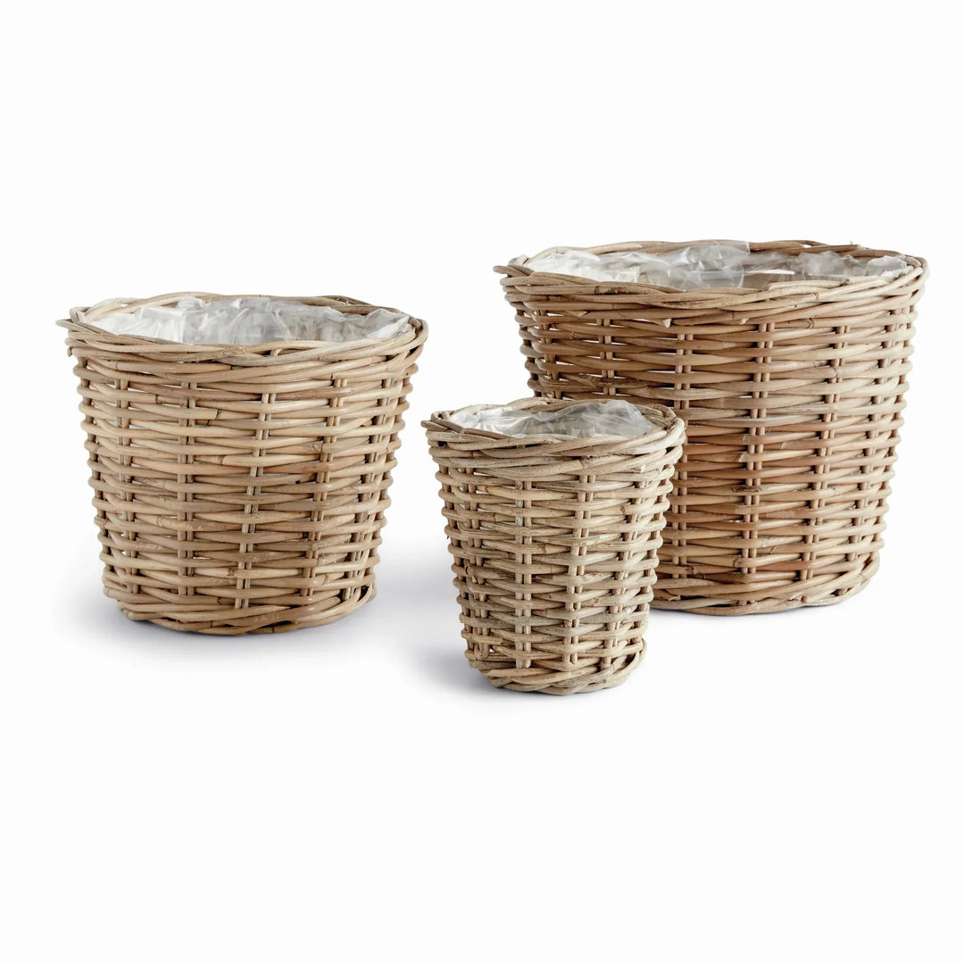 Three tapered handwoven rattan basket planters with fitted clear plastic liners, arranged against white, Modern Farmhouse