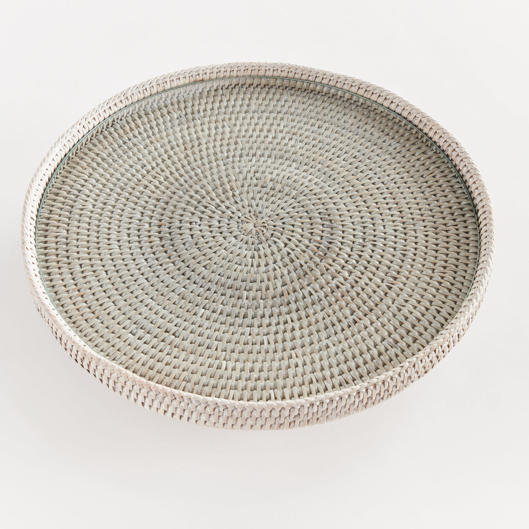 Top view of Hadley whitewash rattan stand showing the radiating pattern beneath its glass insert and circular rim. Coastal