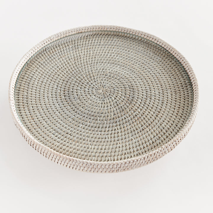Top view of Hadley whitewash rattan stand showing the radiating pattern beneath its glass insert and circular rim. Coastal