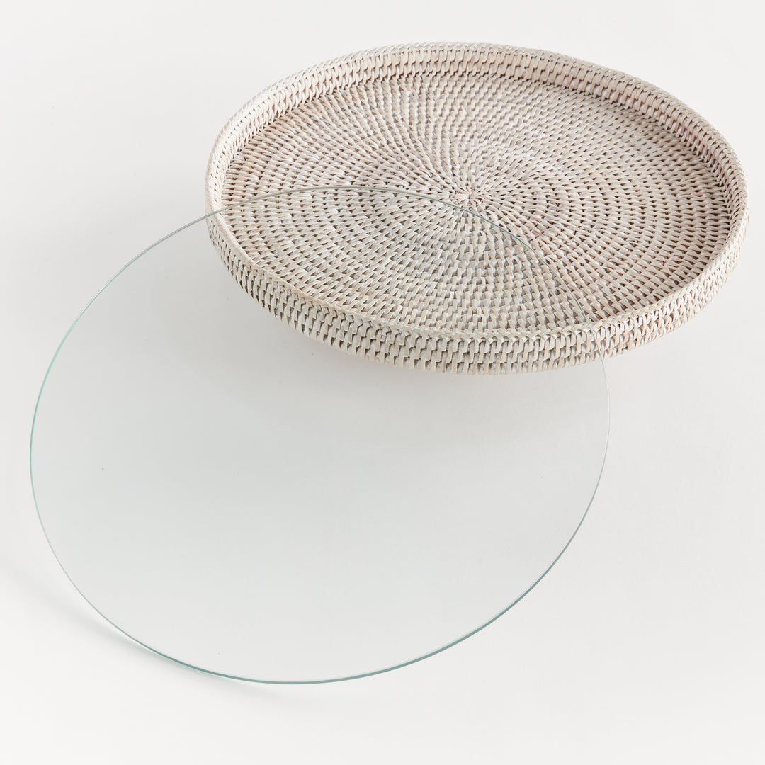 Hadley whitewash rattan stand with its removable round glass insert placed separately beside the raised platform. Coastal