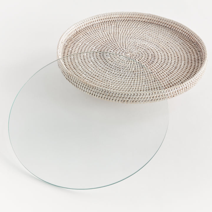 Hadley whitewash rattan stand with its removable round glass insert placed separately beside the raised platform. Coastal