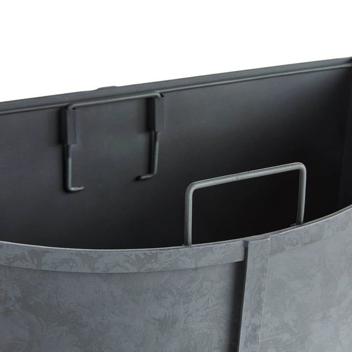 Angled view of powder-coated demilune planter showing banded frame and short profile