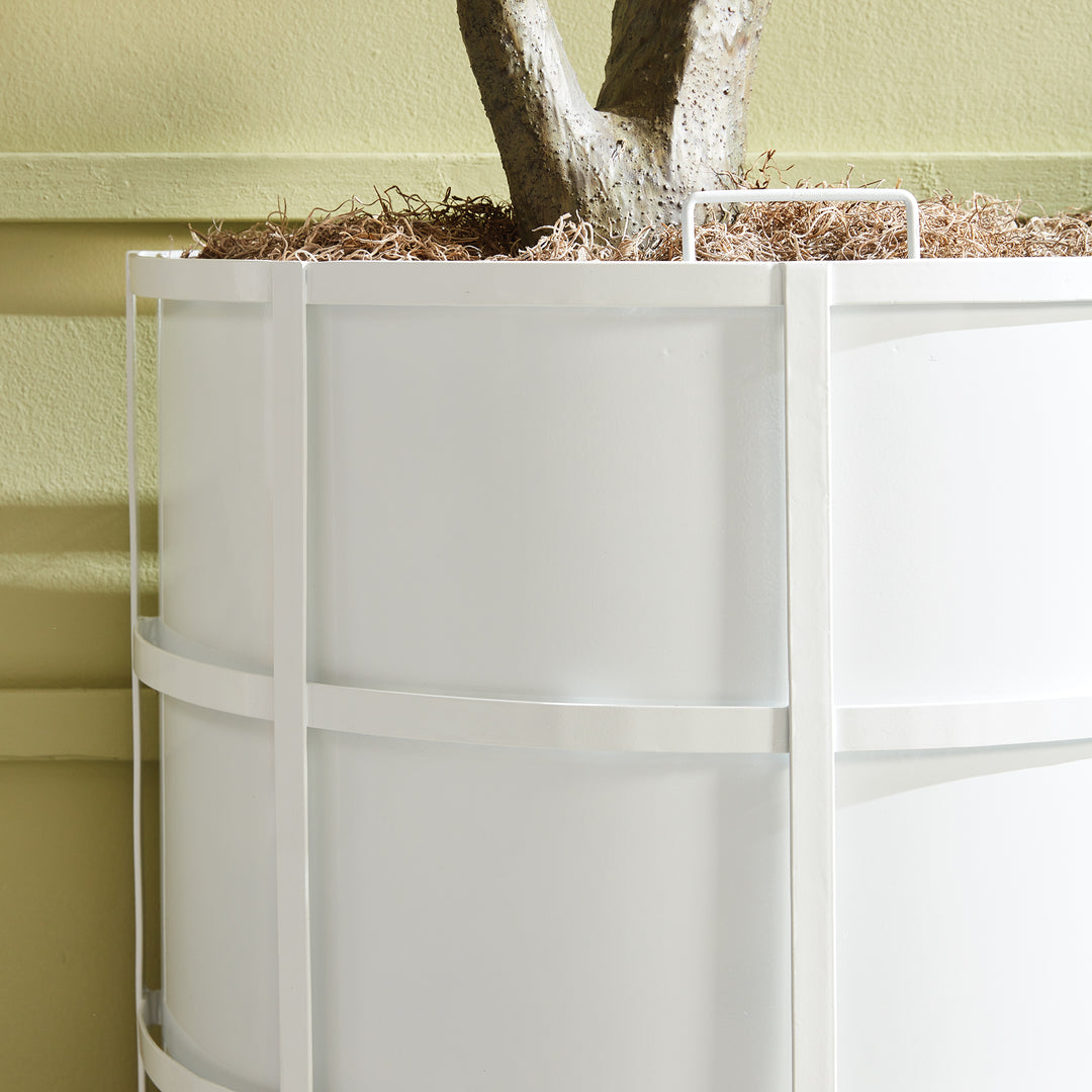 Close-up of white half-round iron planter with vertical banding and clean powder-coated finish, styled for transitional outdoor spaces.