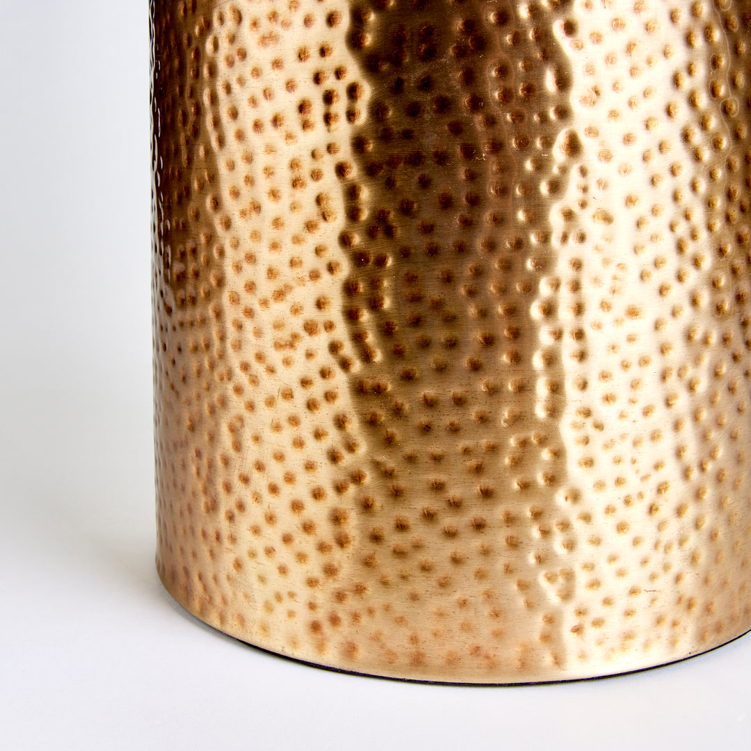 Close-up of hammered brass texture with hand-finished detailing
