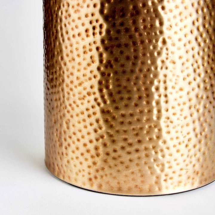 Close-up of hammered brass texture with hand-finished detailing