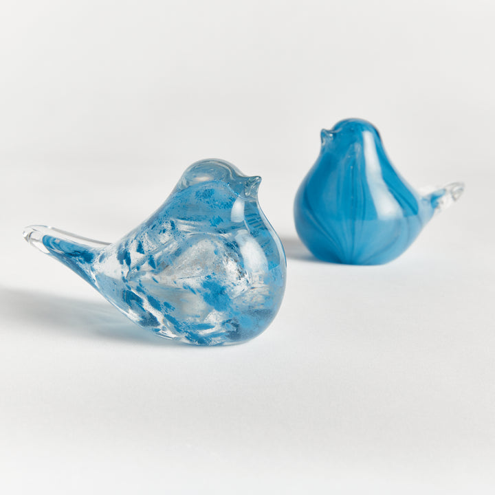 Handcrafted blue glass finch sculptures set of two with smooth rounded shapes, decorative bird accents for interior display.