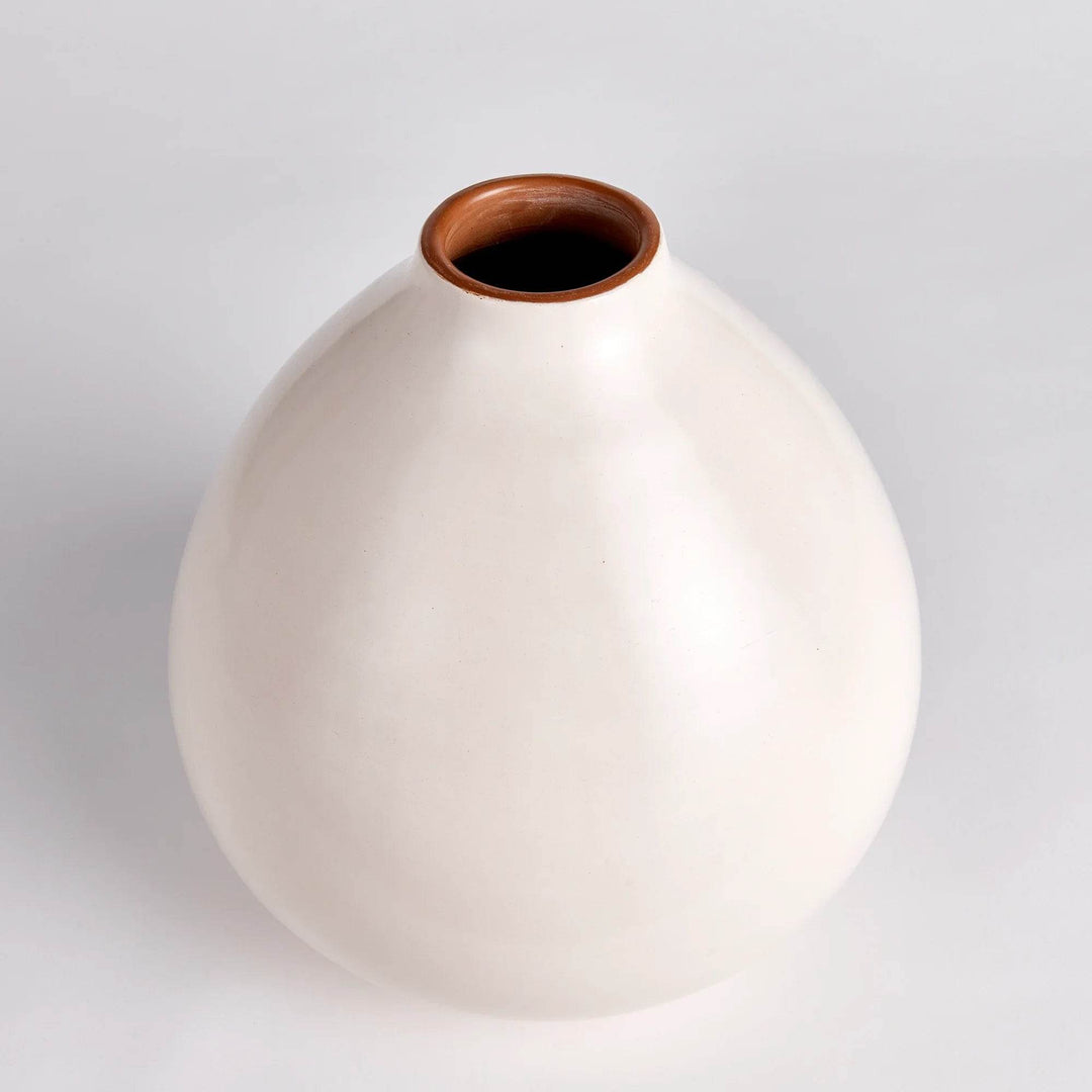 Ecru bulbous ceramic vase photographed from the side showing hand-shaped form and subtle color variation – Modern Organic

