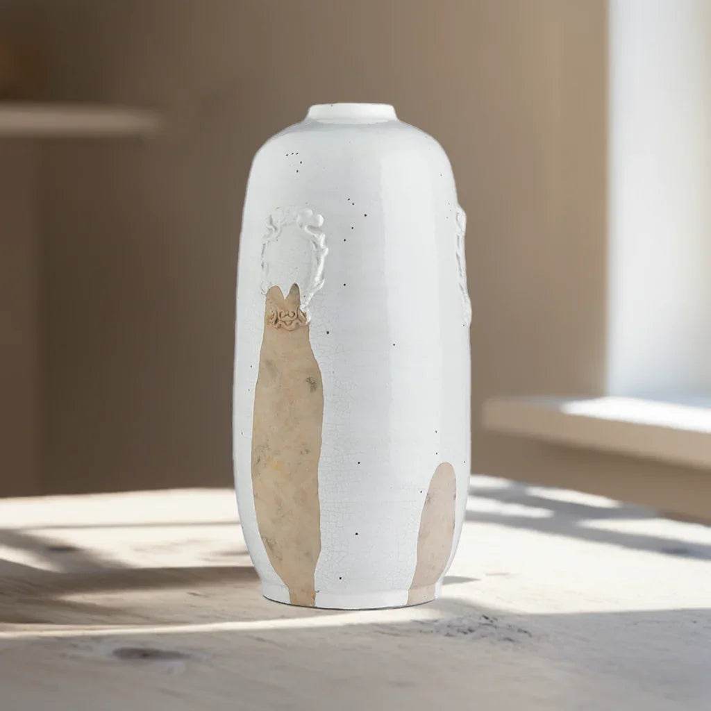 Side view of handcrafted tall white ceramic vase with exposed clay accent, perfect for modern or transitional decor.

