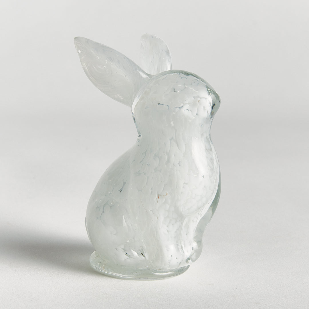 Handcrafted white glass bunny figurine with glossy finish and upright form, small decorative sculpture for tabletop display.