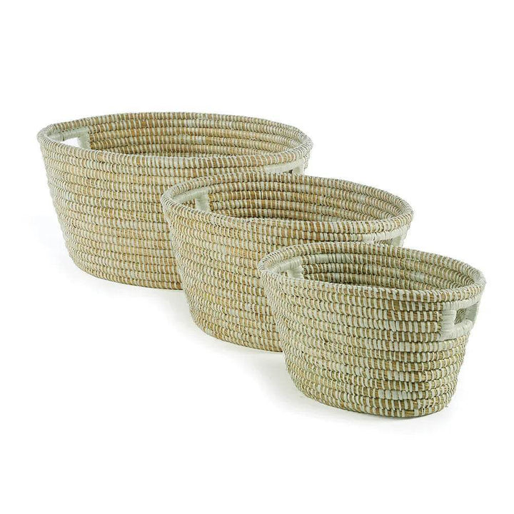 Set of three white oval woven storage baskets in rivergrass with modern organic styling and soft natural finish.