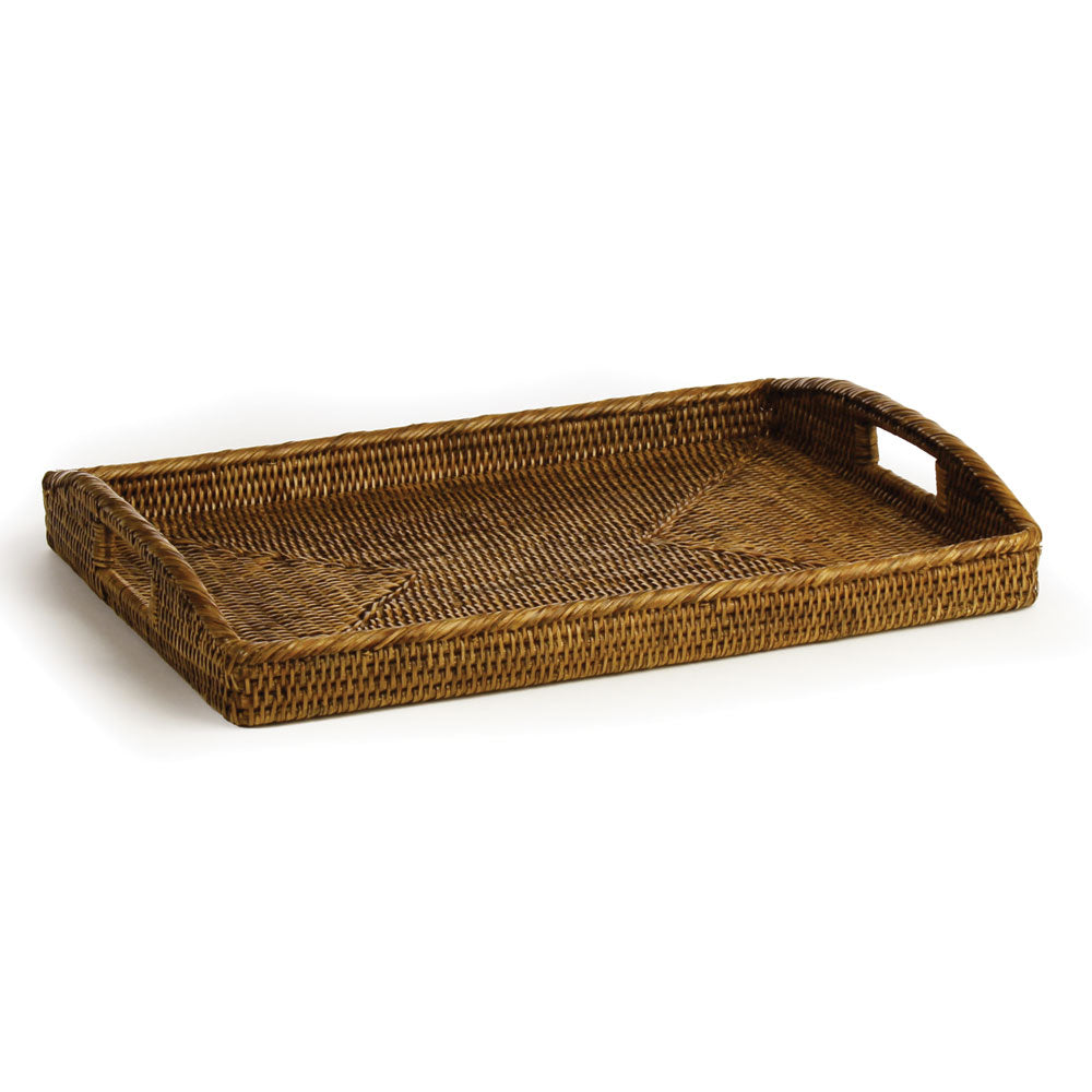 Warm brown rectangular rattan tray with woven sides, raised handles and a patterned base on white - Coastal Transitional