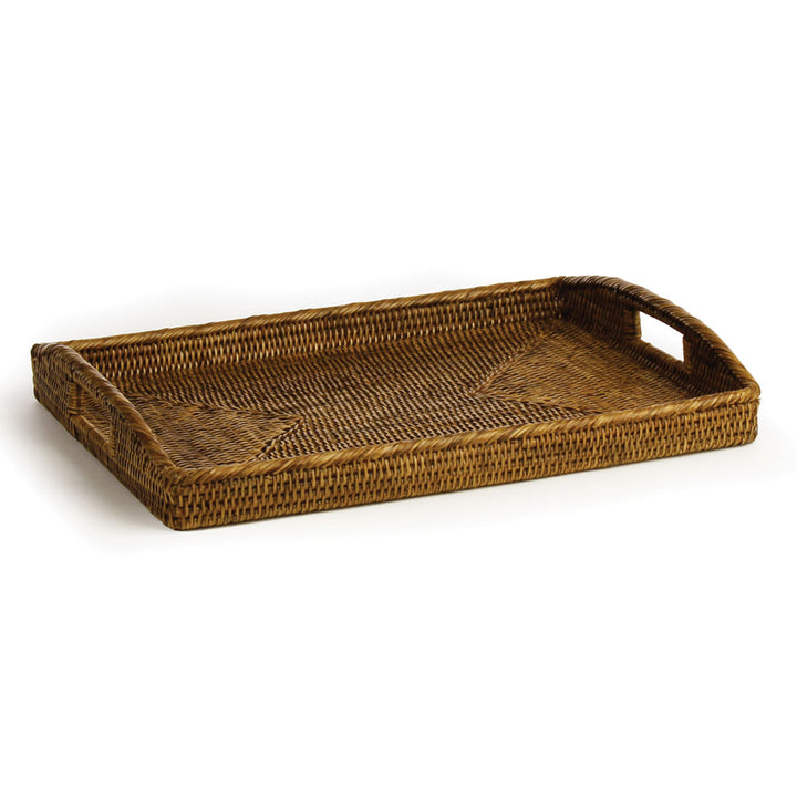 Warm brown rectangular rattan tray with woven sides, raised handles and a patterned base on white - Coastal Transitional
