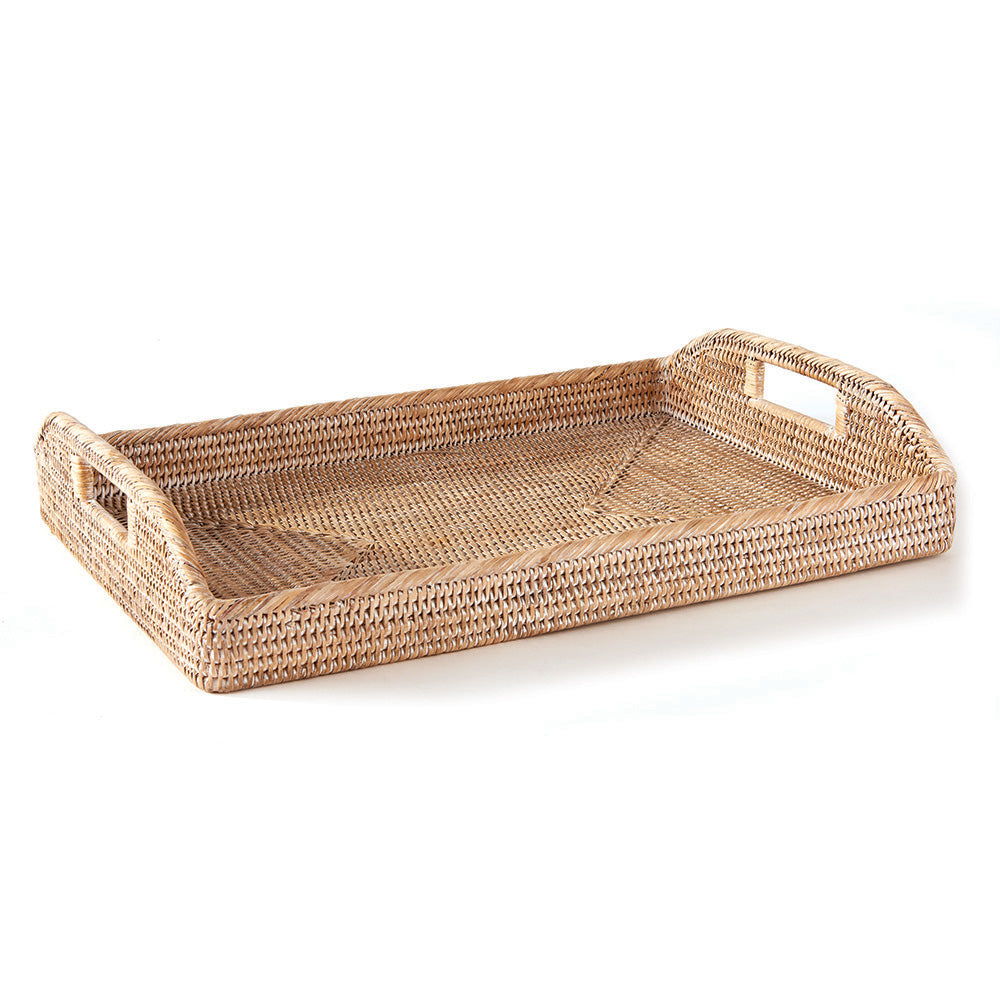 Whitewash rectangular rattan tray with woven sides, raised handles and patterned base on plain white - Coastal Transitional