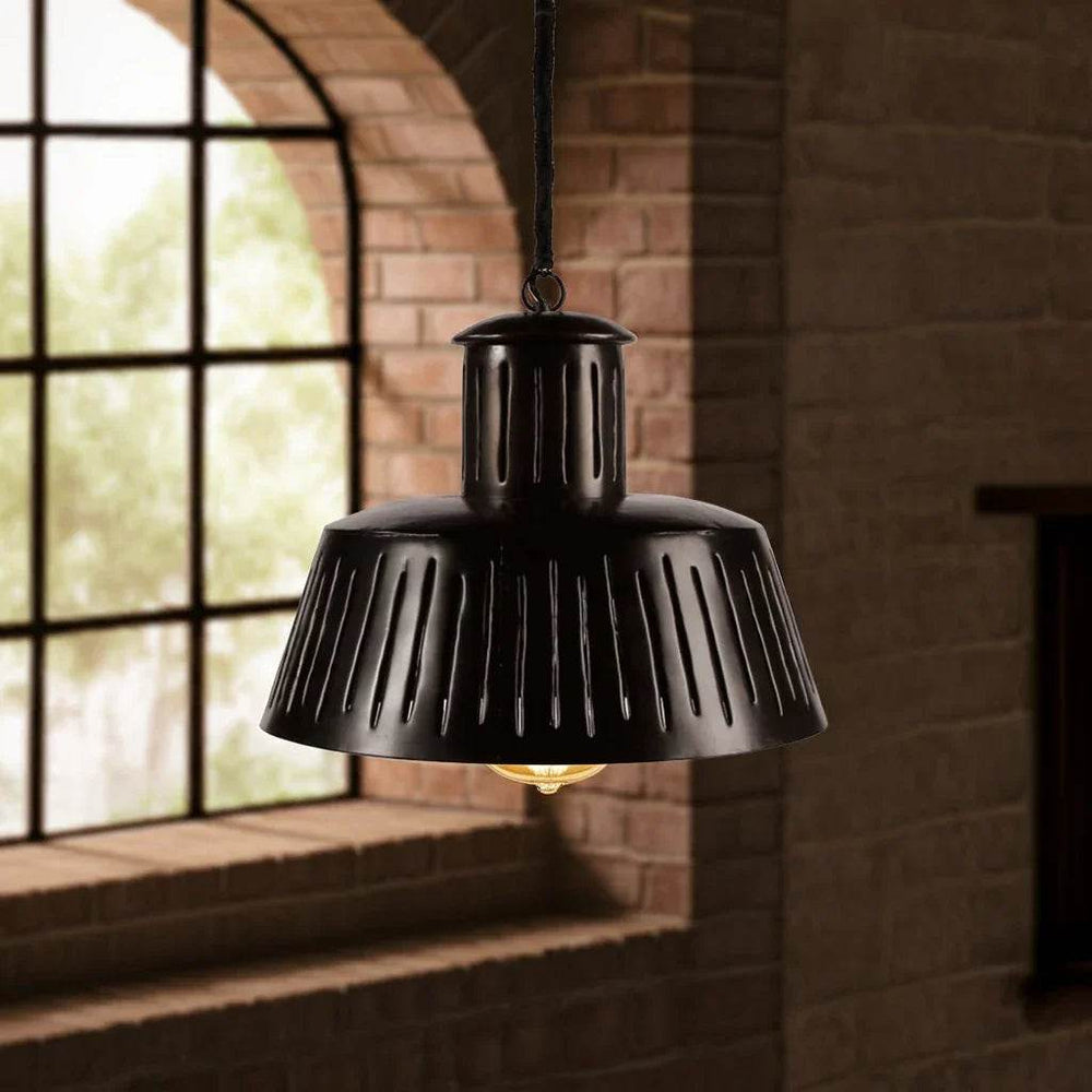 Black metal pendant light with slotted shade near arched window in loft space – Modern Industrial.