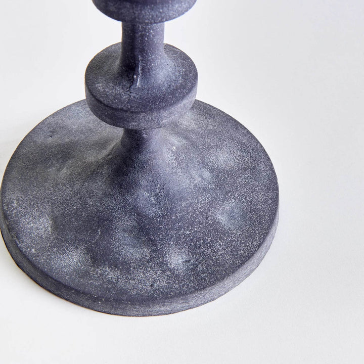 Close-up of notched column design on black industrial candle stand, aluminum construction with matte finish – Industrial