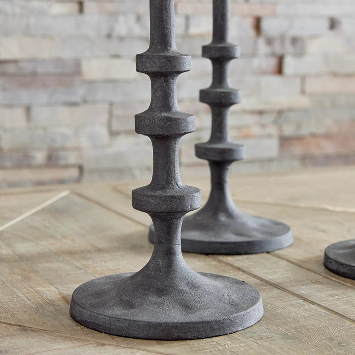Close-up of column design on industrial black taper holder, showing stepped notches and textured finish – Industrial