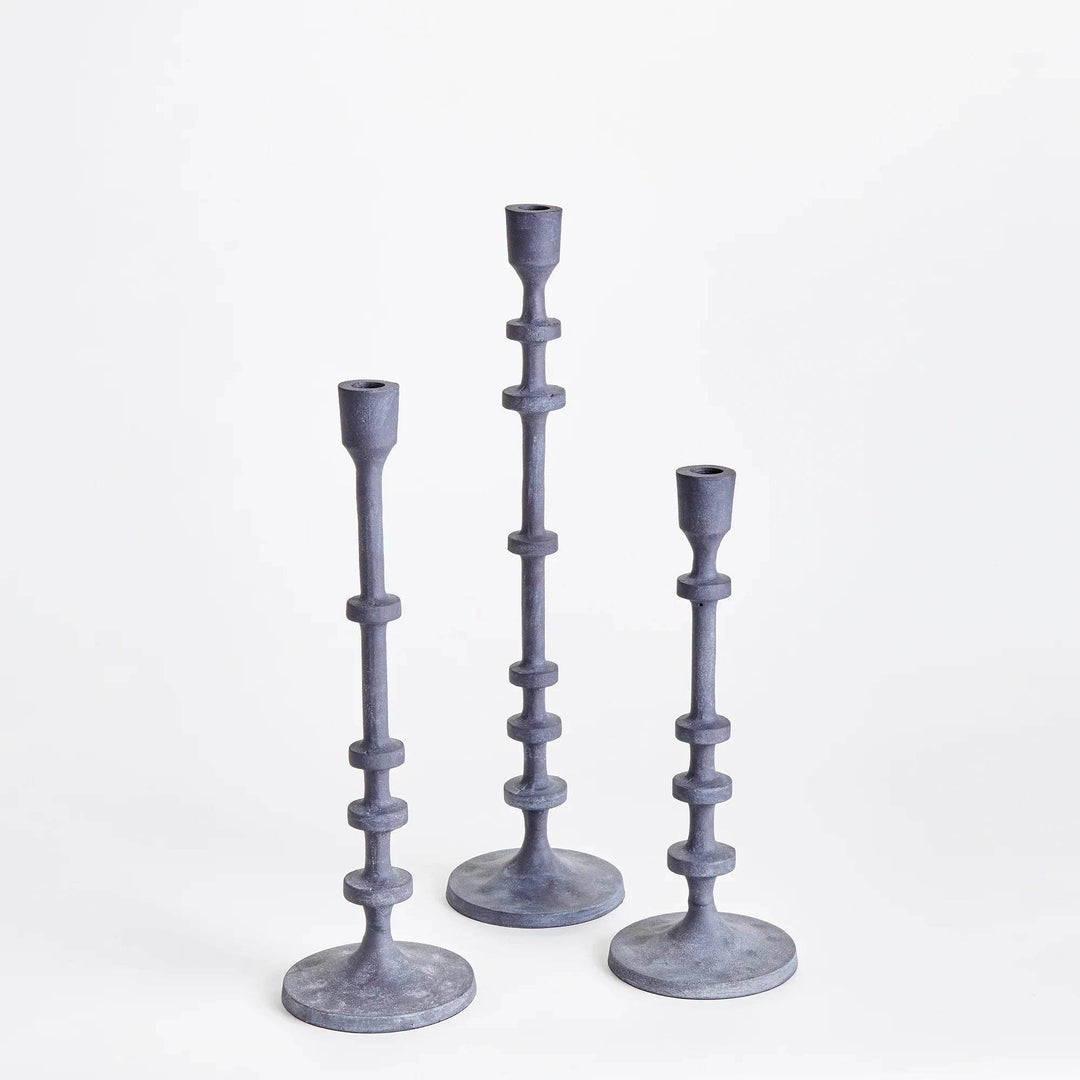 Pair of industrial black taper candle holders displayed without candles, studio shot with clean backdrop – Minimal Decor