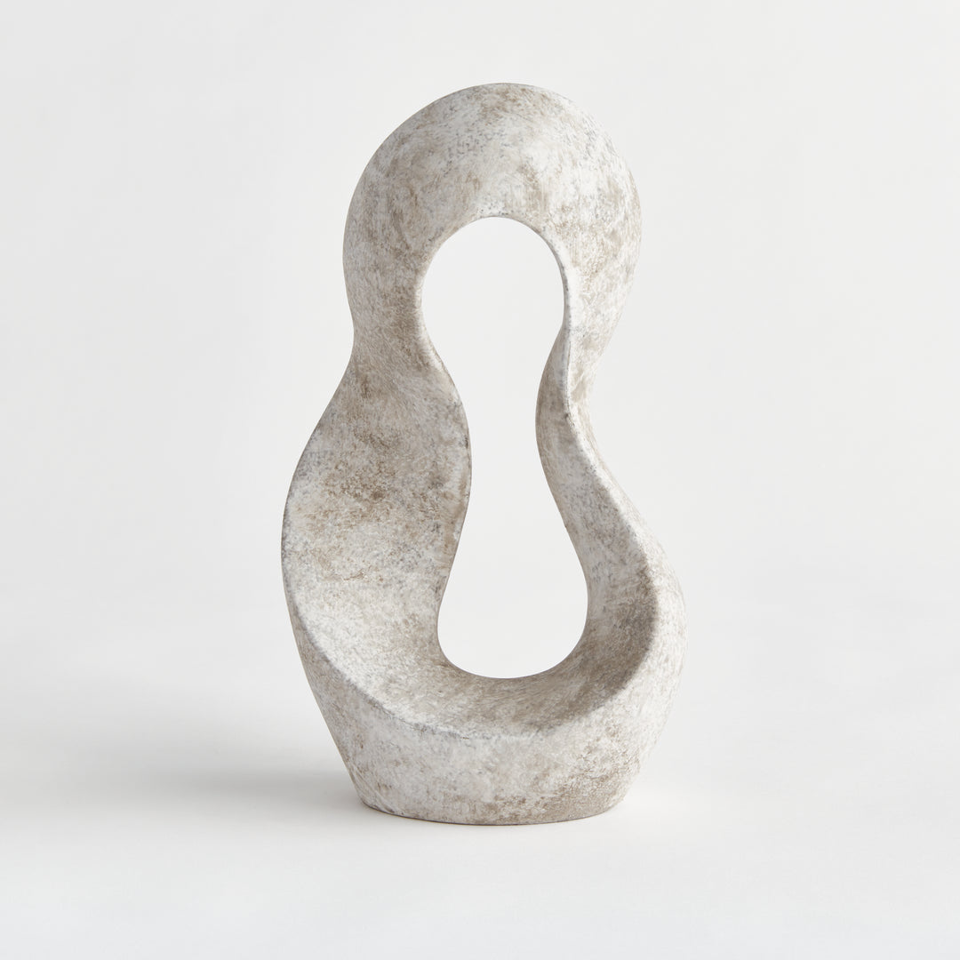 Full frontal view of abstract curved clay sculpture with negative space center and matte earthstone surface, captured in even studio light.