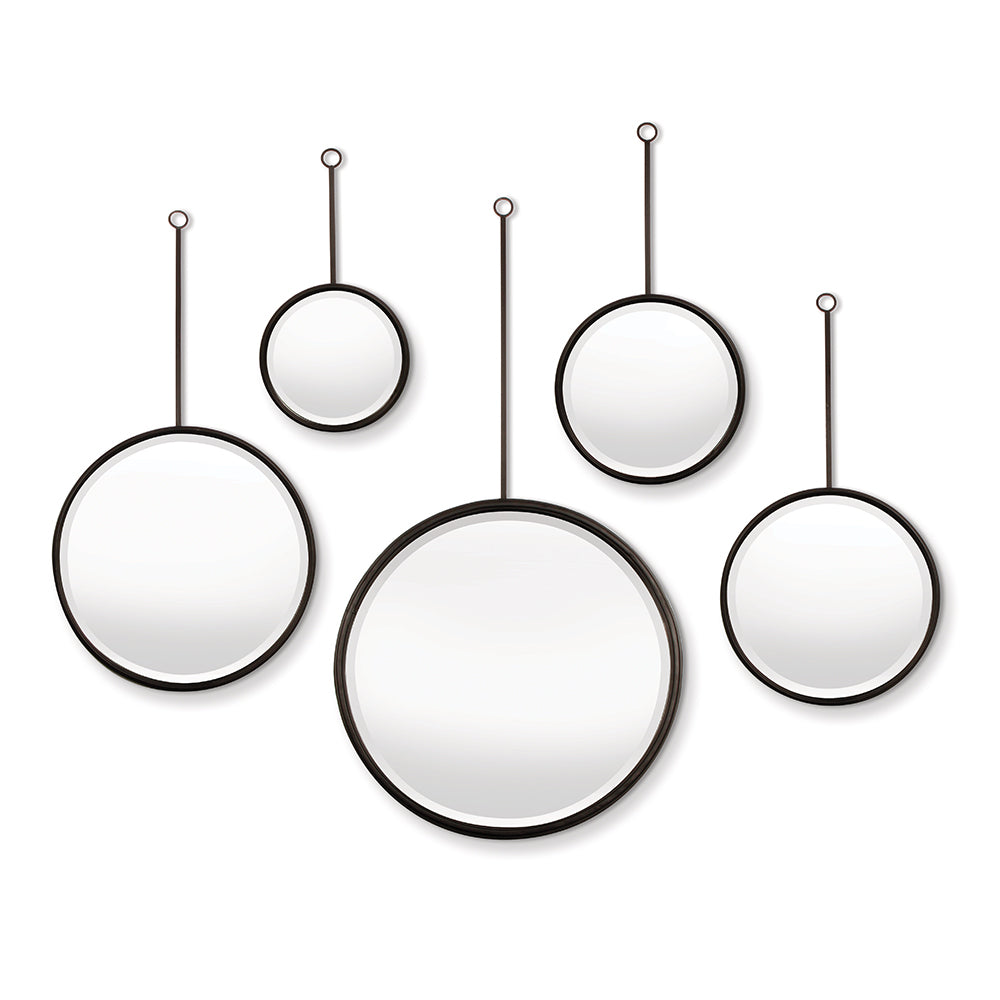 Five iron-framed round mirrors of varying sizes suspended from rods against a white background in a sculptural layout.