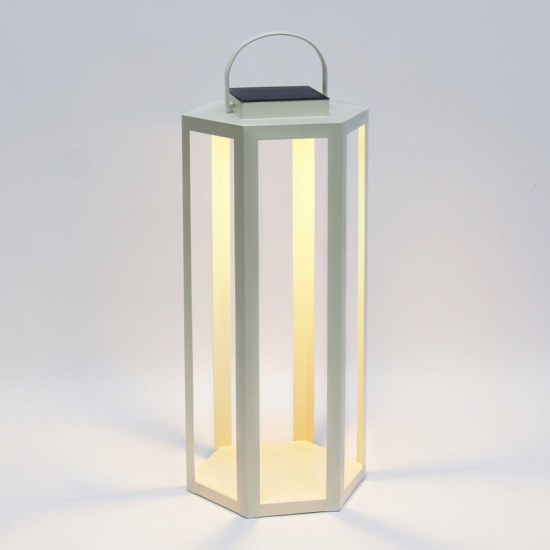 Ivory solar LED lantern with powder-coated iron frame, integrated solar panel, and warm 3000K illumination in a 24-inch height – Modern Coastal