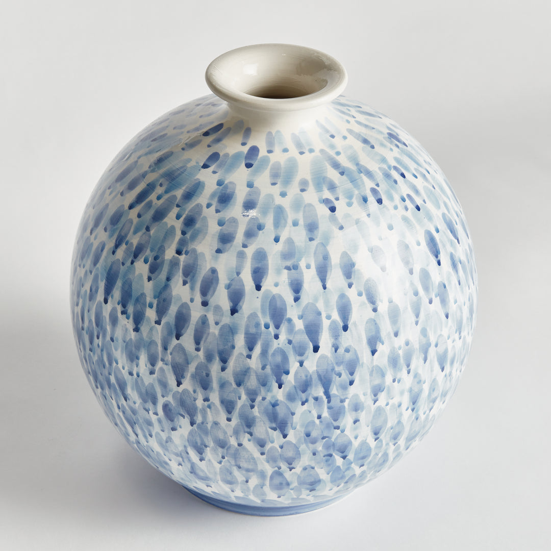 Angled view of a large blue and white ceramic vase with round body, narrow opening and painted pattern, Coastal Transitional
