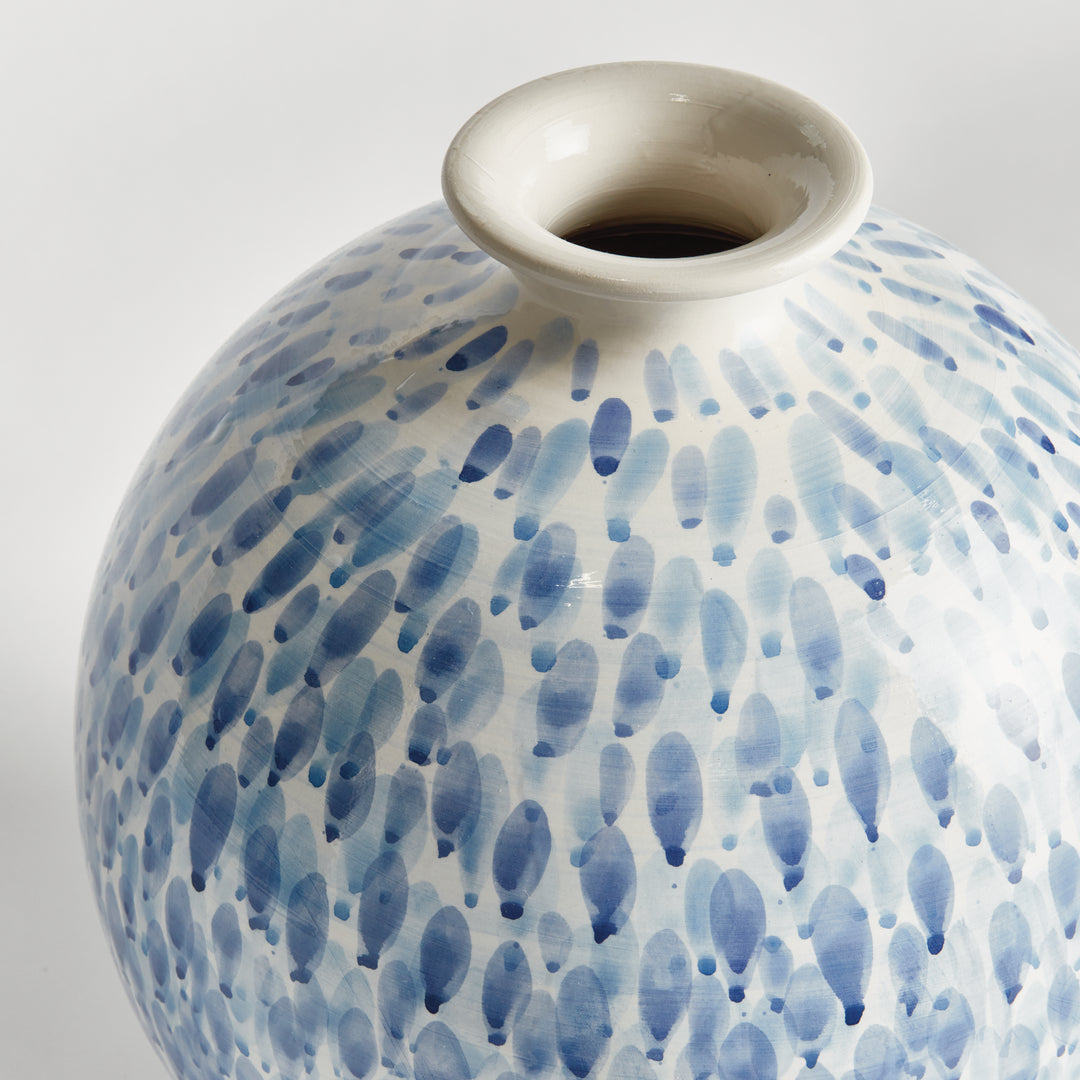 Close view of narrow neck and blue painted droplets on a large white ceramic vase, shown against white, Coastal Transitional