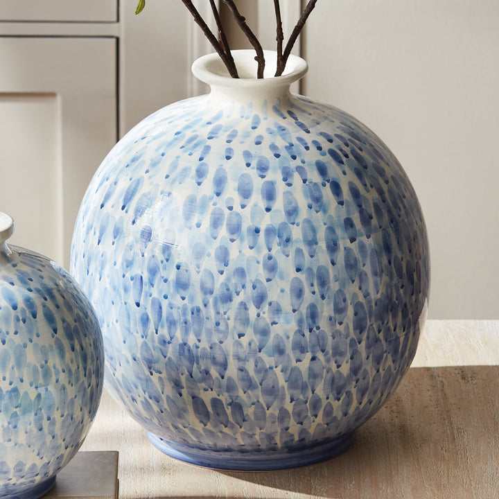 Large blue and white ceramic vase with decorative branches, styled beside smaller matching vase on wood, Coastal Transitional