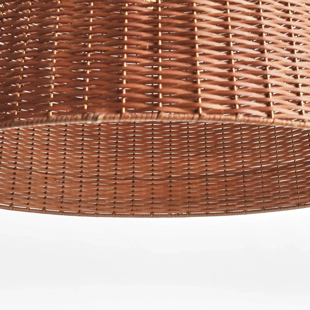 Large brown rattan bell pendant shade viewed from below, with an open rim and repeating woven pattern visible, Coastal style