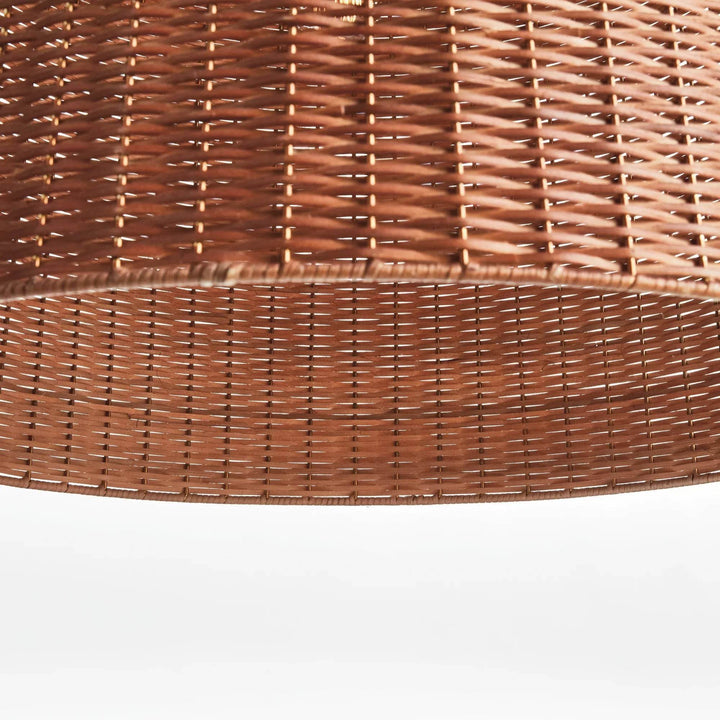 Large brown rattan bell pendant shade viewed from below, with an open rim and repeating woven pattern visible, Coastal style