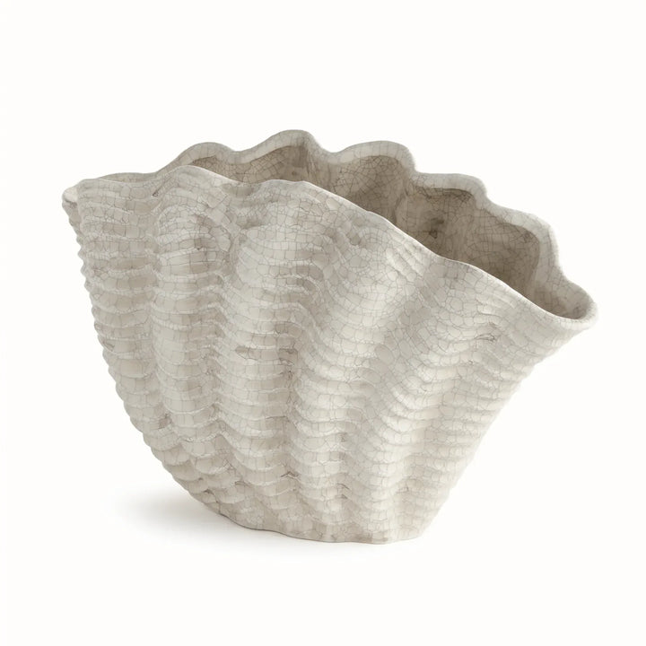 Large cream clay shell vase with a flared scalloped rim and ribbed curved body, shown against white, Coastal Transitional