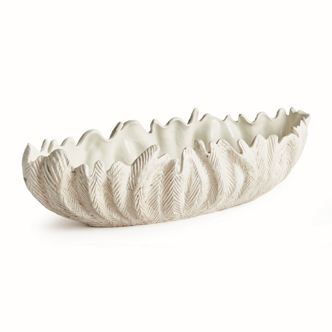 Large decorative oval bowl in ivory with sculpted frond texture and organic wavy rim handcrafted clay centerpiece style