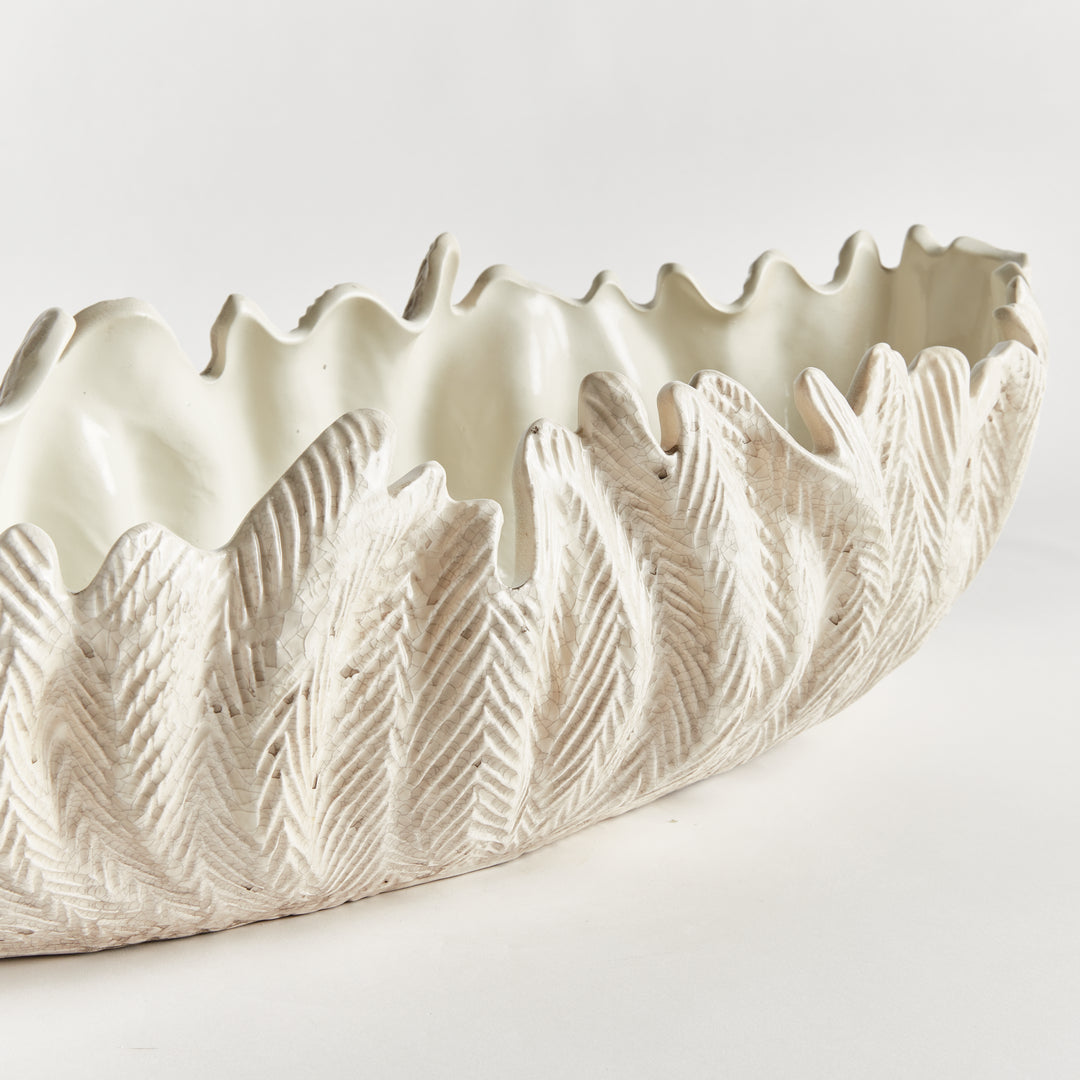 Decorative oval bowl in ivory with sculpted frond texture elongated handcrafted clay vessel centerpiece style