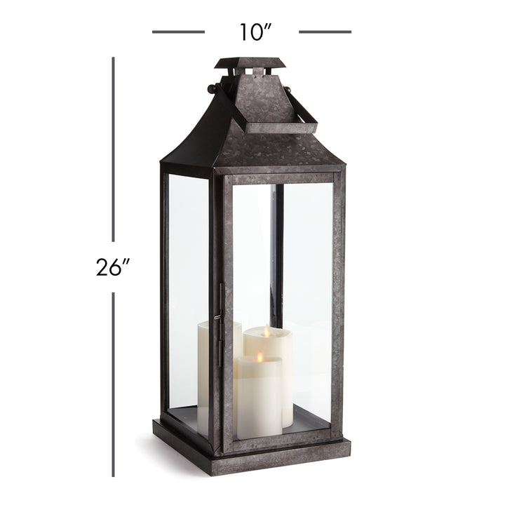 Large galvanized metal outdoor lantern with pillar candle and glass panels for transitional exterior decor style