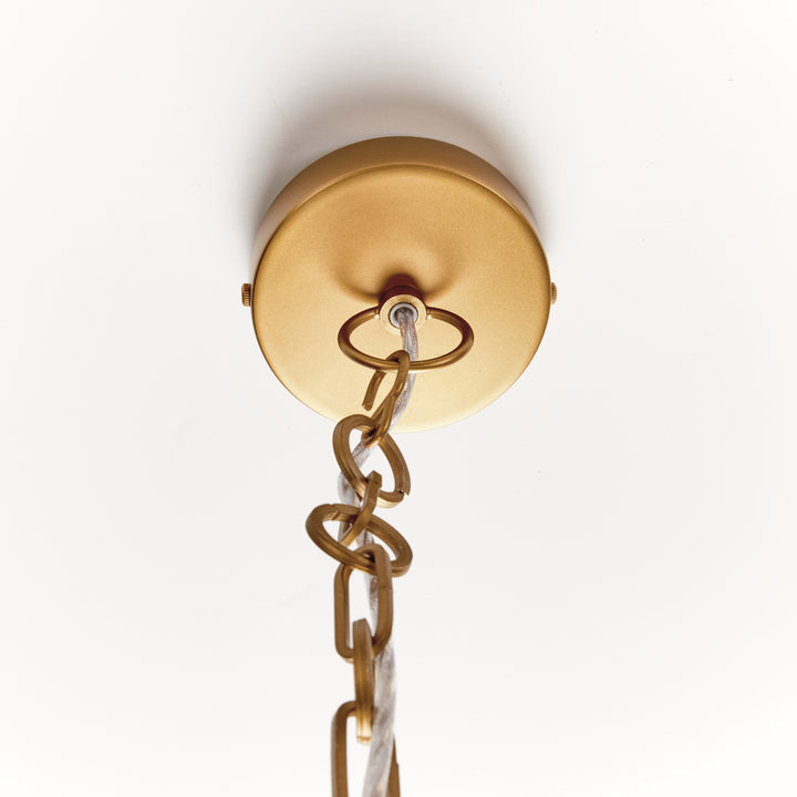Ceiling canopy and chain detail of large gold iron dome pendant light showing mounting hardware and suspension connection. Contemporary